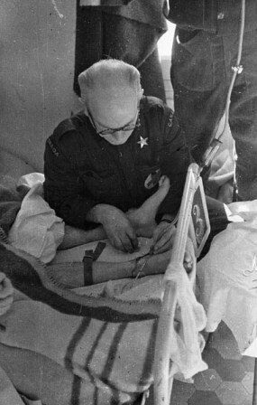 Dr. Norman Bethune attending to a patient, 1937